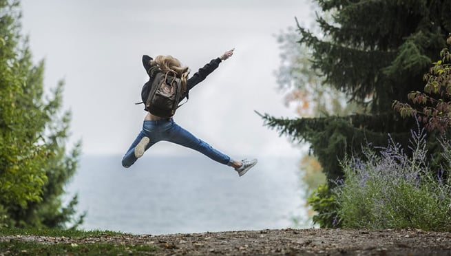 Girl jumping in the middle of nowhere