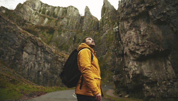 Traveler looking above on road Traveler looking above on road