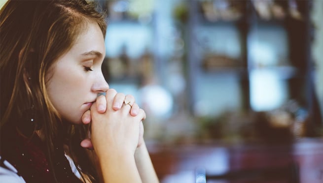 Girl thinking with eyes closed