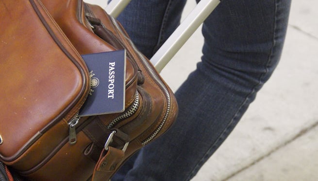 Passport poking out of luggage