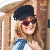 Elena T. looking fashionable with her red sunglasses and jean jacket 