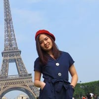 Jenny L. in front of the Eiffel Tower