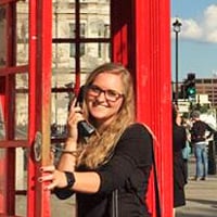 Kayla in a London phone booth