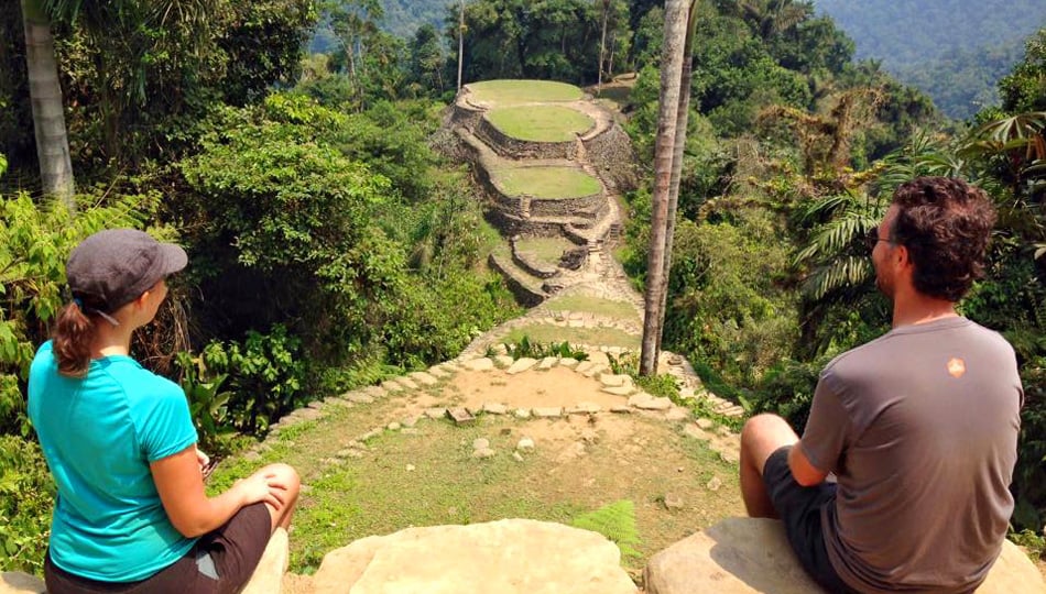 Couple sitting on rocks in Columbia