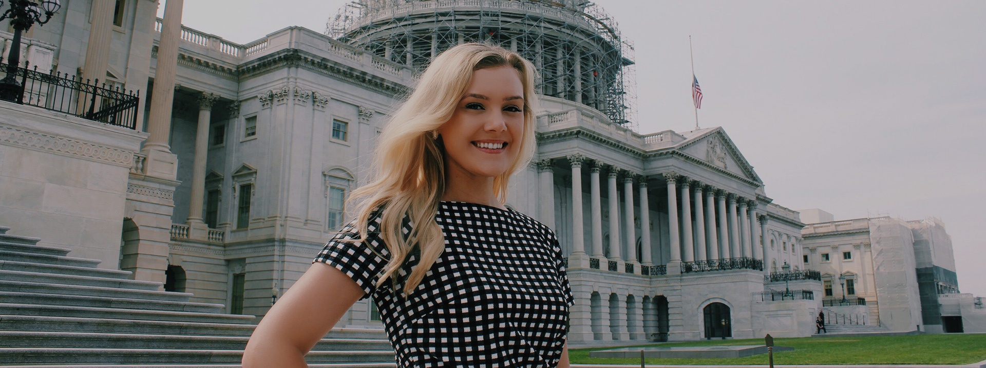Intern standing in front of the US Capitol building 