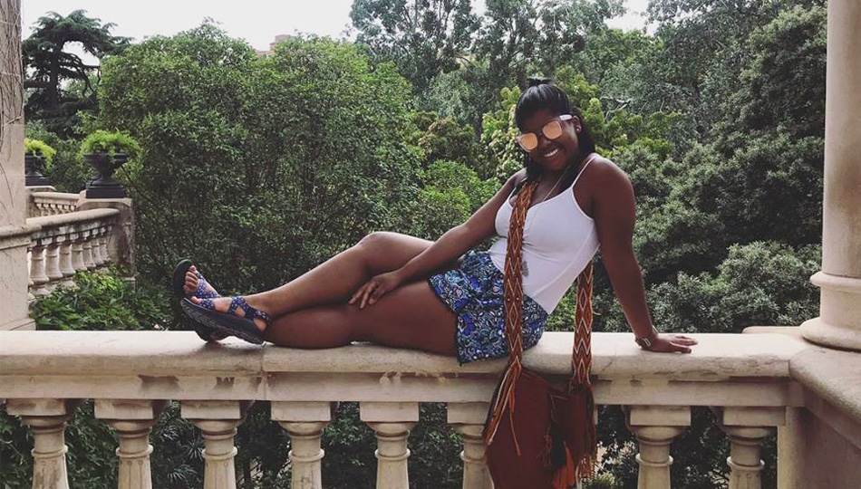 Barcelona Tourism intern Ebony on a balcony