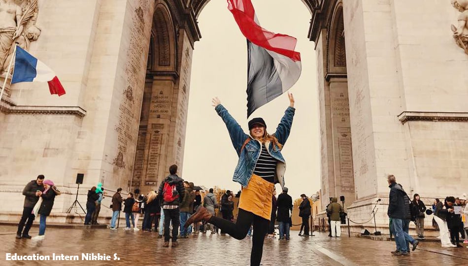 Girl jumping for joy in Paris