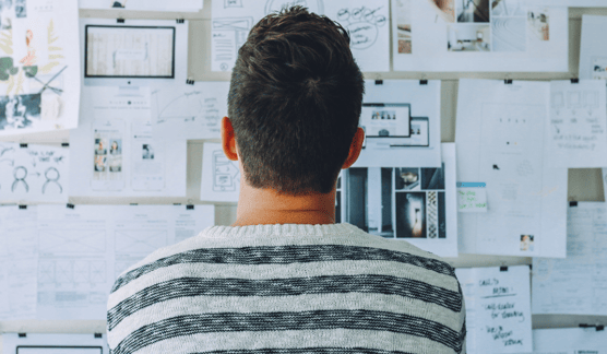 Guy looking at planner