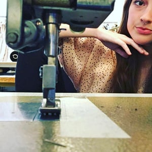 Milan Fashion intern Kelsey with a sewing machine