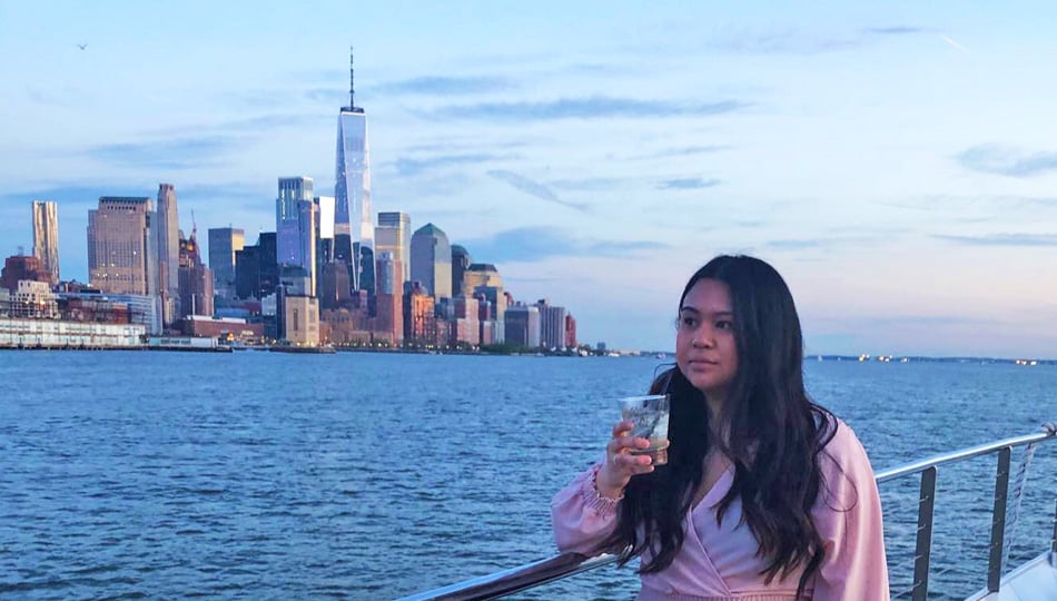 Lindsey on a boat overlooking the New York City skyline