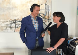 Man interviewing woman for podcast