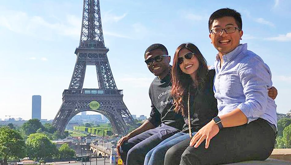 Paris interns by Eiffel Tower