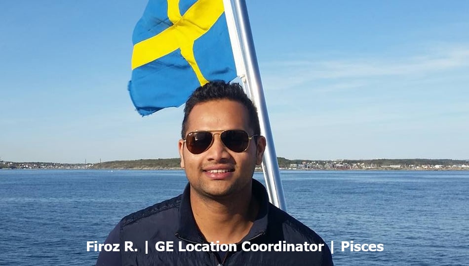 Stockholm Location-Coordinator Firoz in front of Swedish flag