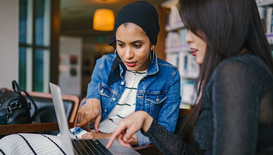 Two Business Women looking at a computer