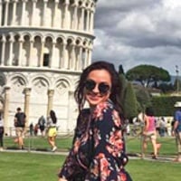Cheyanne J. standing in front of the leaning tower of Pisa