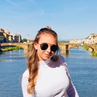 Grace C. on a bridge over a river in Florence