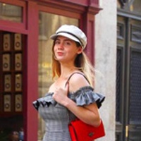 Kristen walking through the streets of Paris