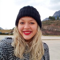 Sarah S. on a boat ride through mountains and hills