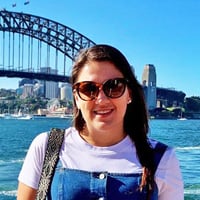 Victoria N. with the Sydney bridge and harbor behind her.