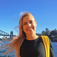 Abby B. on a boat riding through the blue waters of Sydney