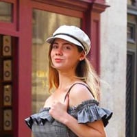 Kristen M. wearing high fashion while walking through the streets of Paris